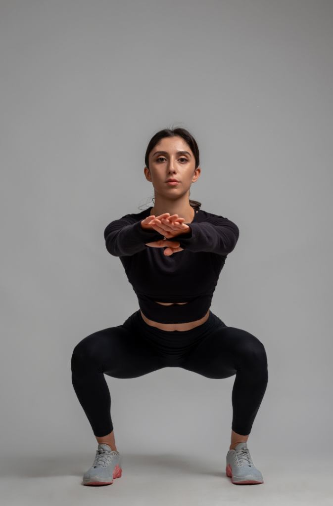 Woman doing squat - front view